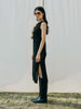 Sassy net knit dress crafted in Switzerland, featuring a classic round neckline, fitting armholes, and stylish side slits, made from organic cotton, perfect for evening wear or summer outings over swimwear