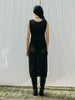Sassy net knit dress crafted in Switzerland, featuring a classic round neckline, fitting armholes, and stylish side slits, made from organic cotton, perfect for evening wear or summer outings over swimwear