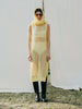 Sassy net knit dress crafted in Switzerland, featuring a classic round neckline, fitting armholes, and stylish side slits, made from organic cotton, perfect for evening wear or summer outings over swimwear