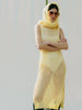 Elegant net knit dress crafted in Switzerland, featuring a classic round neckline, fitting armholes, and stylish side slits, made from organic cotton, perfect for evening wear or summer outings over swimwear.