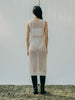 Sassy net knit dress crafted in Switzerland, featuring a classic round neckline, fitting armholes, and stylish side slits, made from organic cotton, perfect for evening wear or summer outings over swimwear
