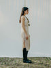 Sassy net knit dress crafted in Switzerland, featuring a classic round neckline, fitting armholes, and stylish side slits, made from organic cotton, perfect for evening wear or summer outings over swimwear