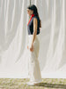 ASTRA: Flared legs, hook closure, handmade fringes. Sustainable, versatile, stylish. GOTS certified.