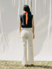 ASTRA: Flared legs, hook closure, handmade fringes. Sustainable, versatile, stylish. GOTS certified.