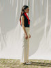 ASTRA: Flared legs, hook closure, handmade fringes. Sustainable, versatile, stylish. GOTS certified.