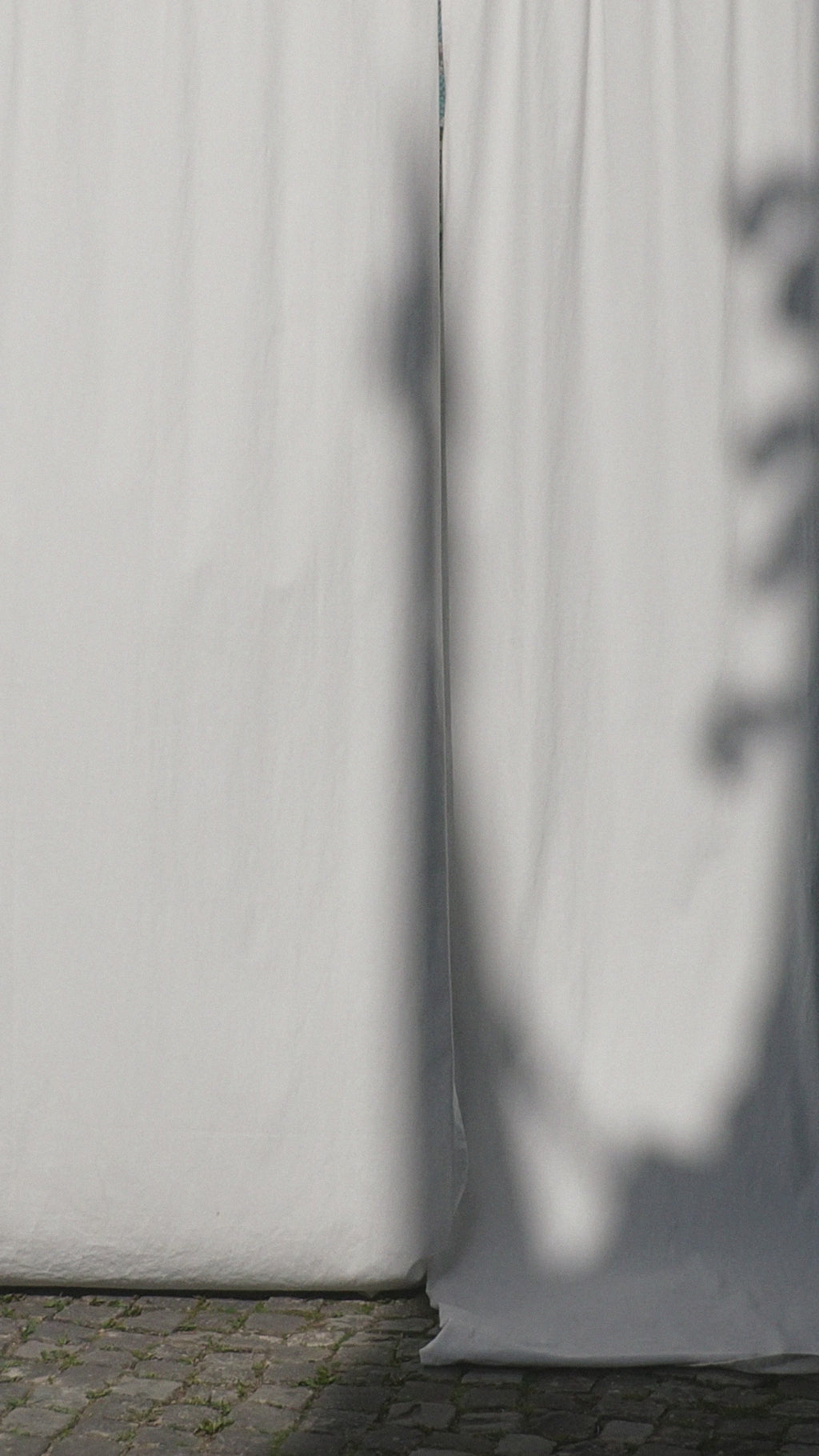 Sanaa dress: puff sleeves, feminine neckline, organic cotton satin, GOTS certified, available in black and white.